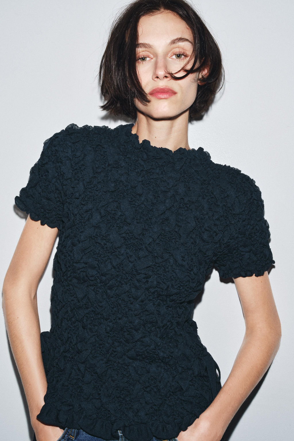 TEXTURED KNIT TOP WITH BOWS