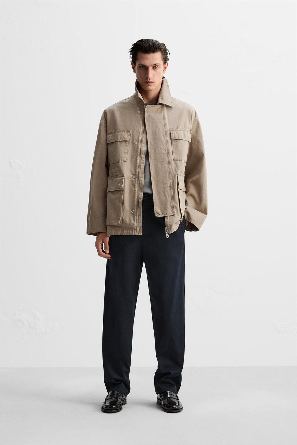 PLEATED CHINO TROUSERS