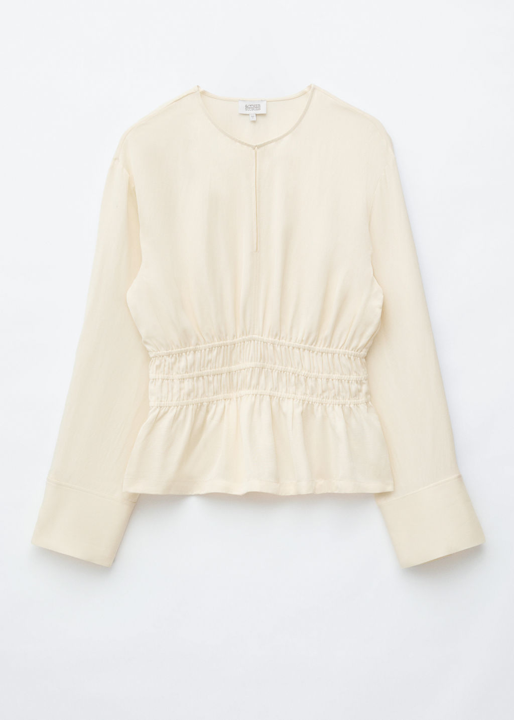 Blusa de lino y cintura fruncida con nido de abeja
