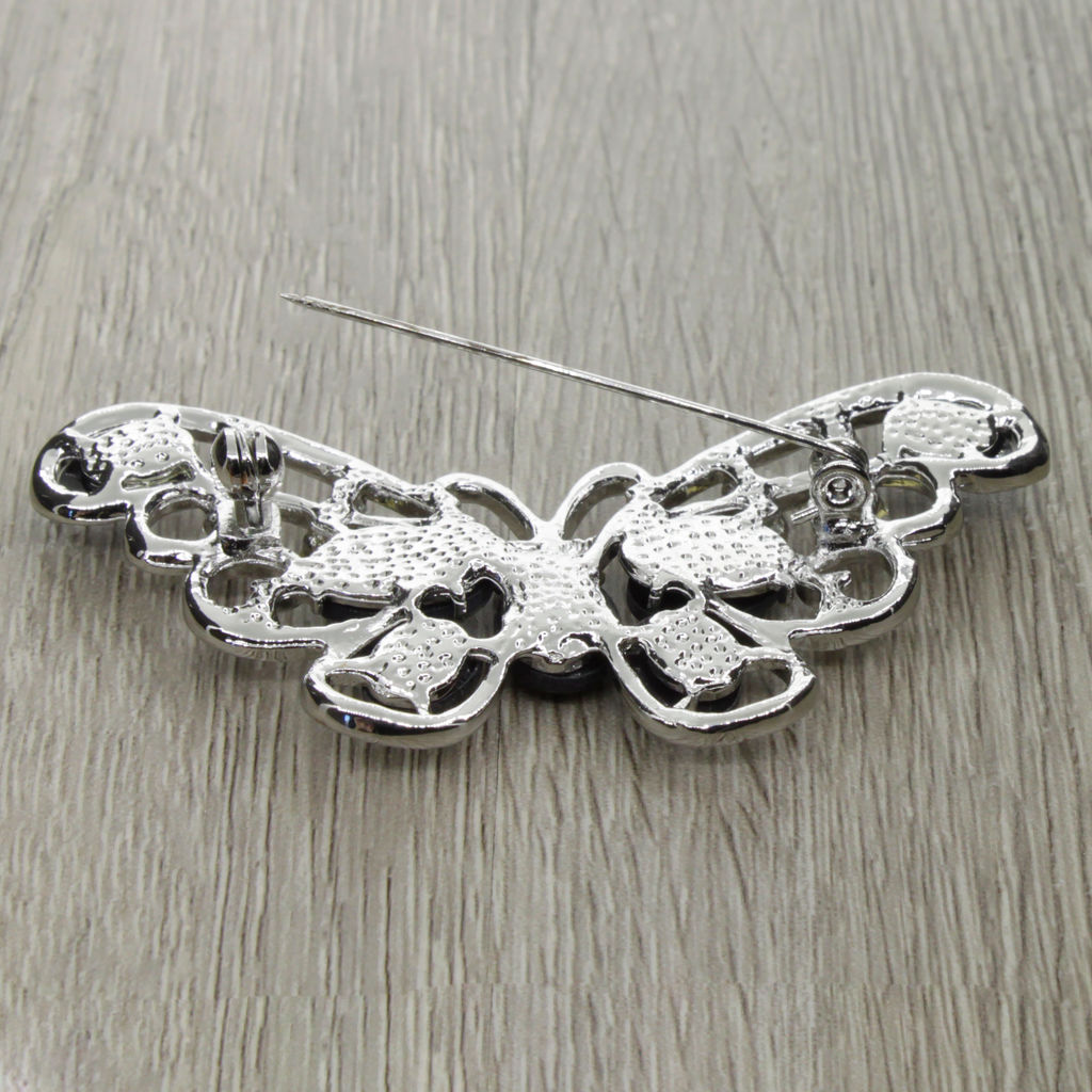 Брошь "Бабочка" со вставками из гелиотиса и ювелирного сплава