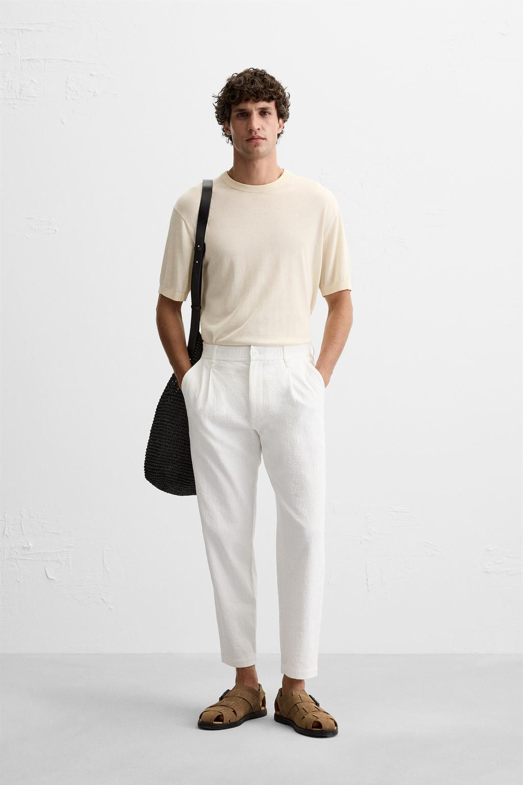 TEXTURED PLEATED TROUSERS