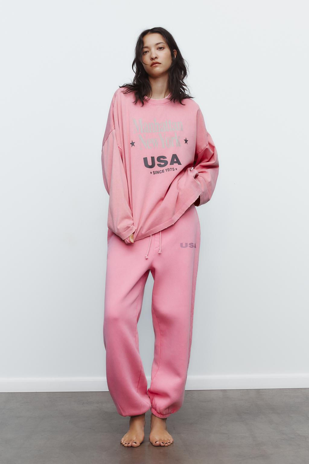 WASHED-EFFECT PLUSH TROUSERS WITH SLOGAN