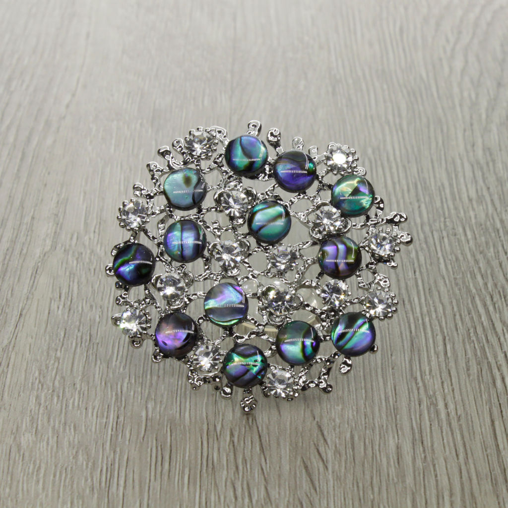 Брошь-подвеска "Калейдоскоп" со вставками из гелиотиса и ювелирного сплава