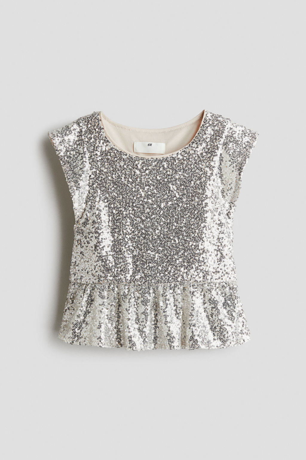 Top de lentejuelas con peplum