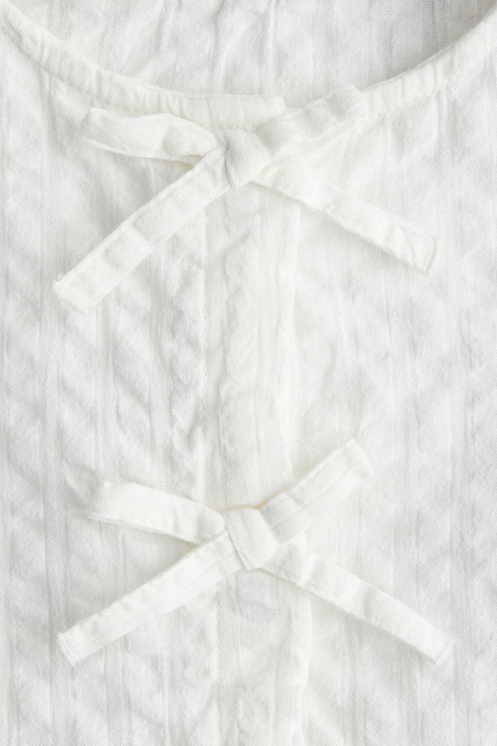 Blusa en sirsaca de algod?n con peplum