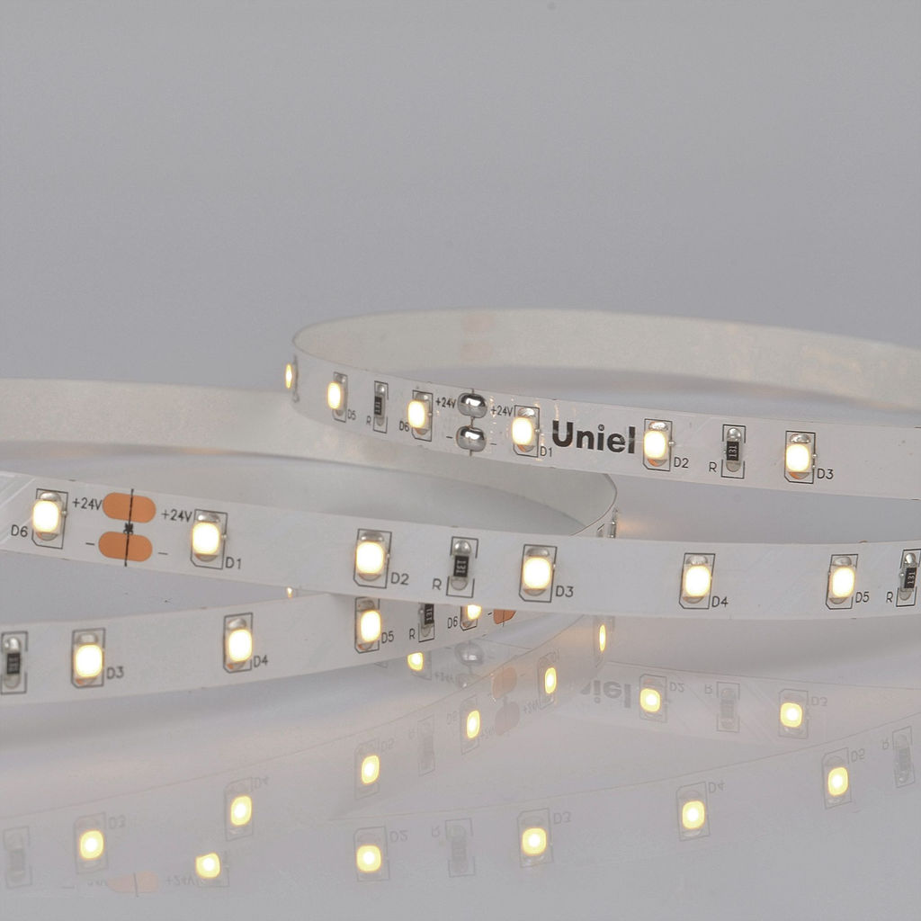 ULS-2835-60LED/m-8mm-IP20-DC24V-6W/m-5M-WW Гибкая светодиодная лента на самоклеящейся основе. Катушка 5 м. в герметичной упаковке. Теплый белый свет (3000K). ТМ Uniel.
