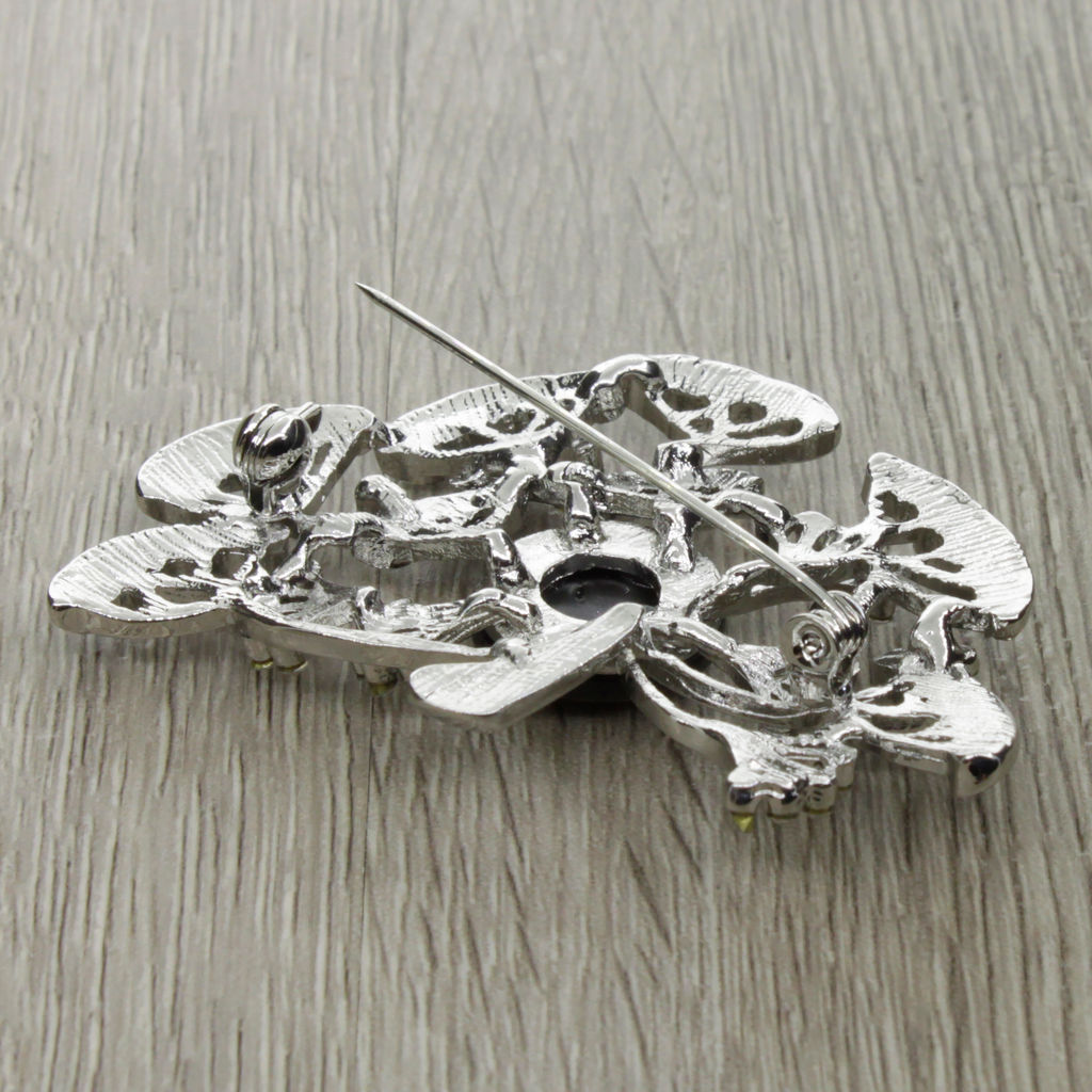 Брошь "Воздушный одуванчик" со вставкой из гелиотиса и ювелирного сплава