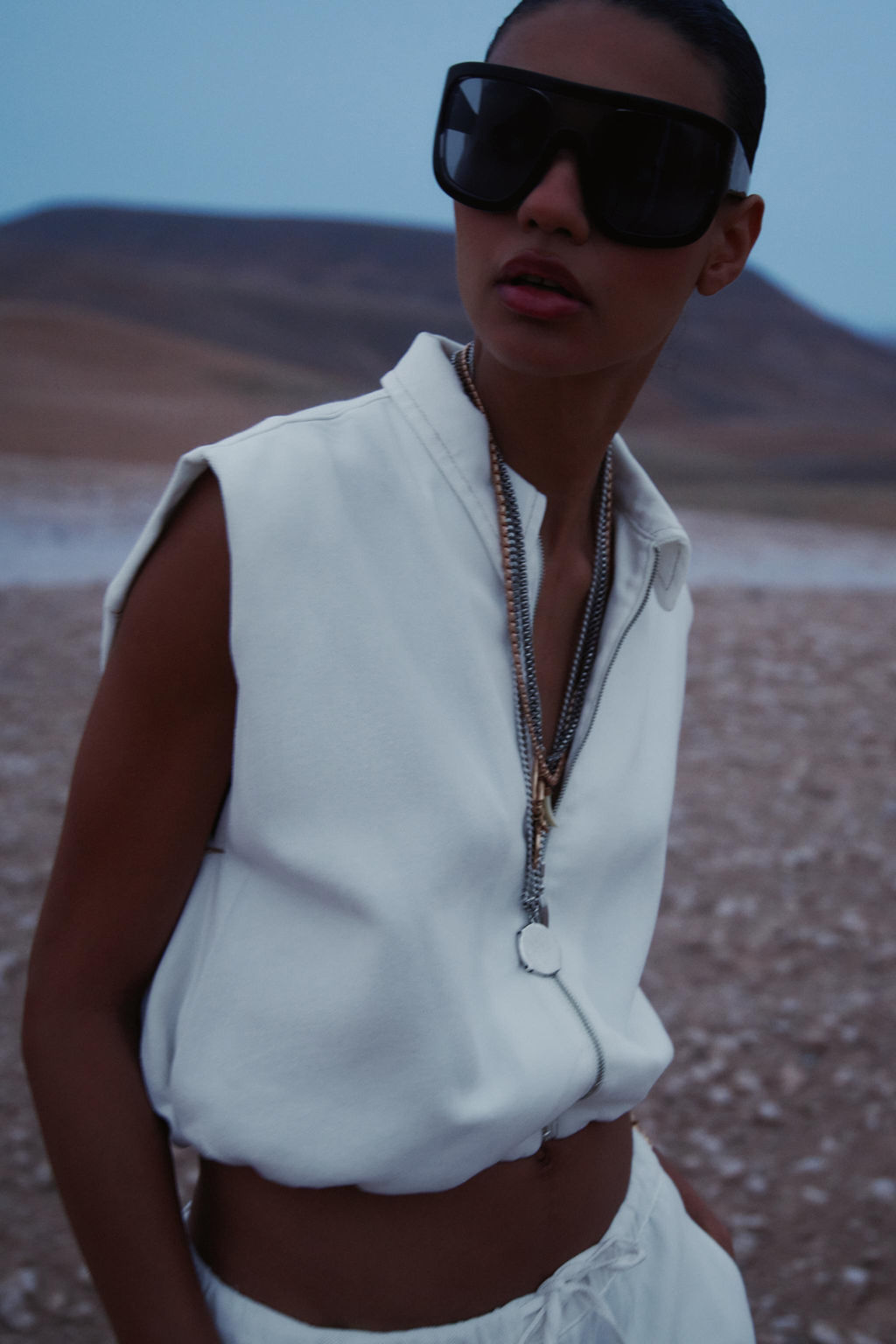 TOPSTITCHED WAISTCOAT WITH ELASTICATED HEM