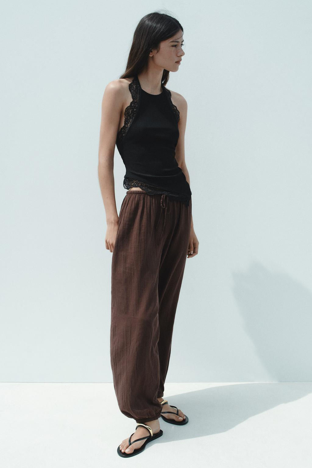 SANDALS WITH METAL APPLIQUE