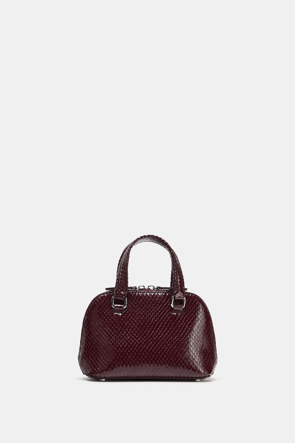 MINI CITY EMBOSSED HANDBAG