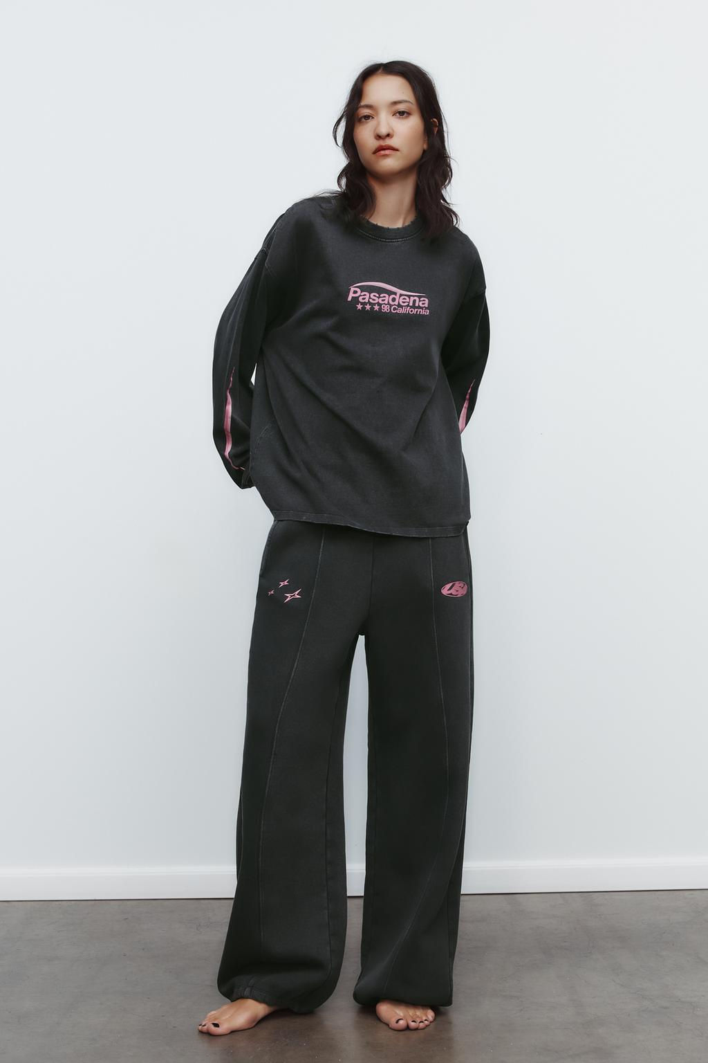 WASHED EFFECT PLUSH TROUSERS WITH SLOGAN