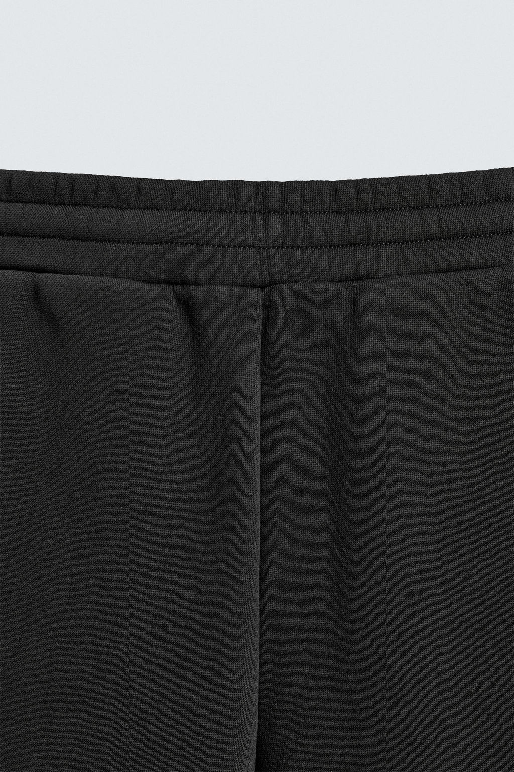 NEOPRENE-EFFECT PLEATED BALLOON FIT TROUSERS