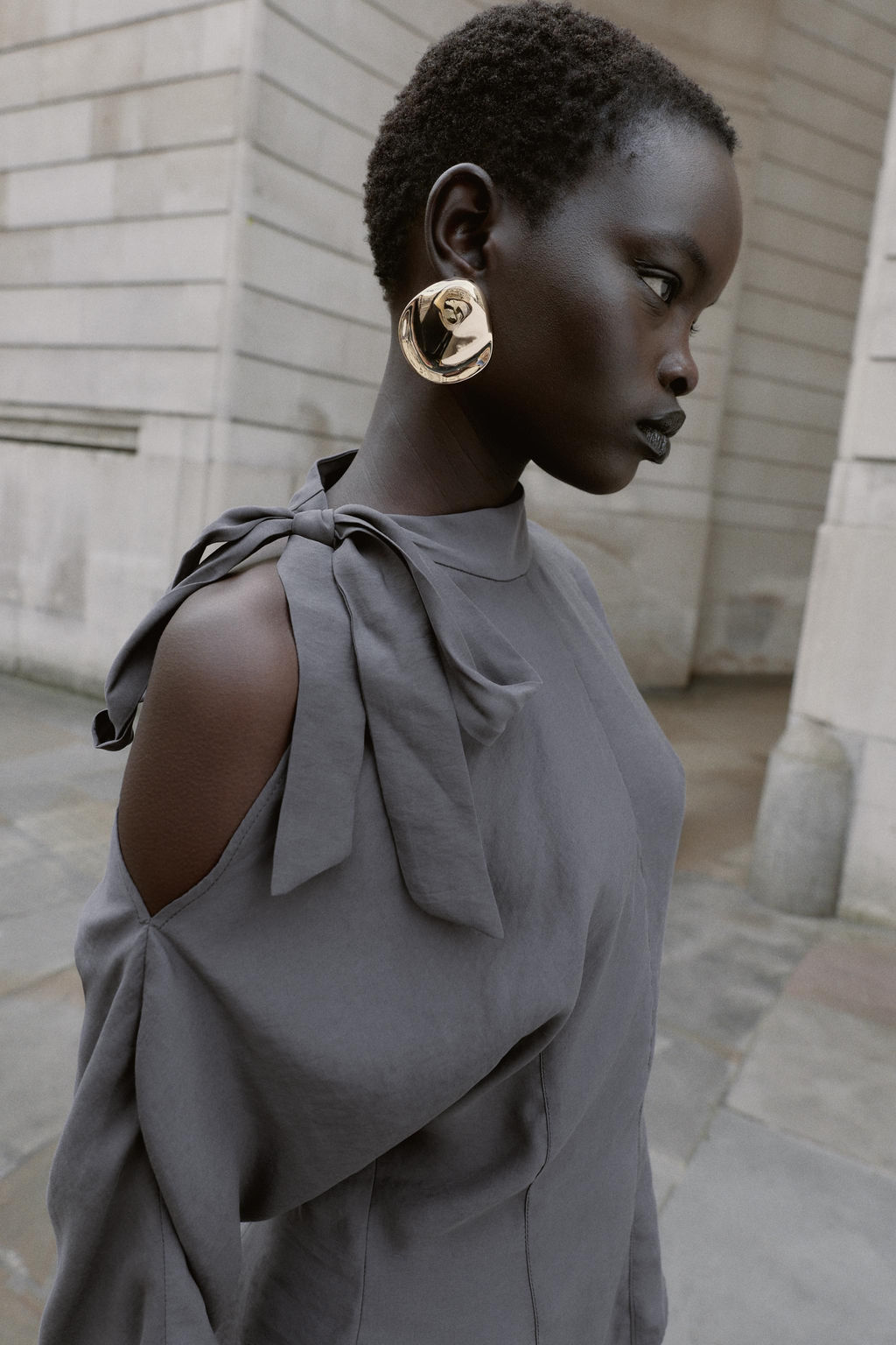 BLOUSE WITH SHOULDER OPENING AND BOW