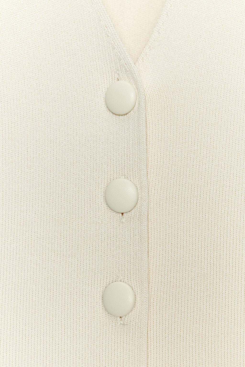 BUTTONED KNIT WAISTCOAT WITH COVERED BUTTONS