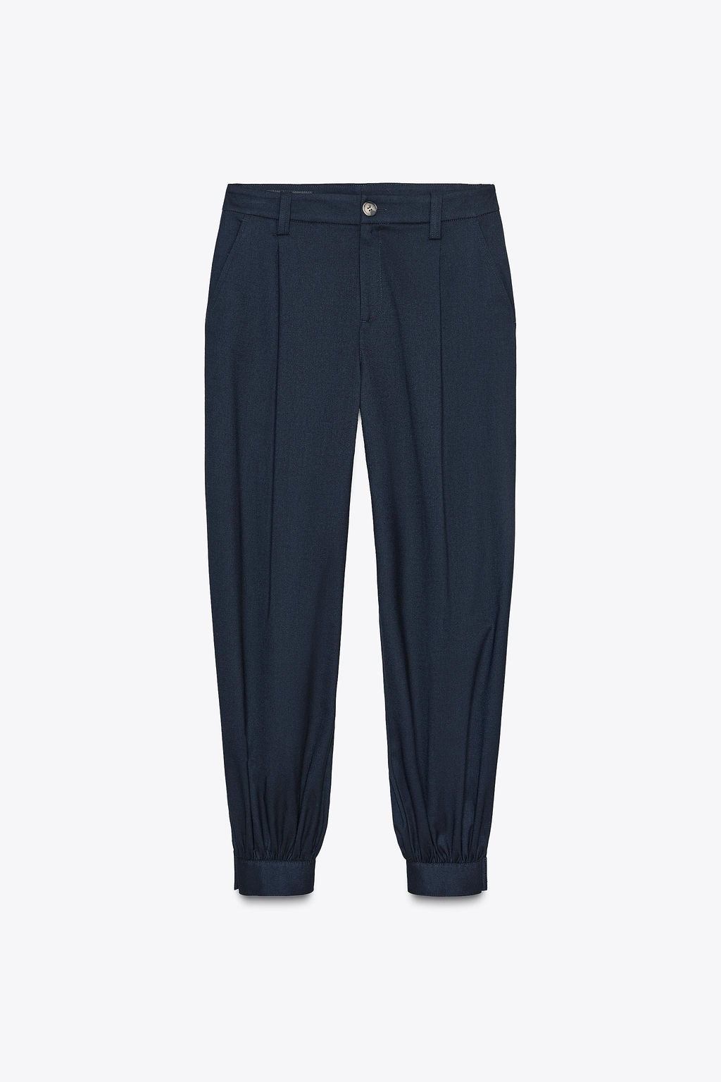 PLEATED TROUSERS WITH BUTTONED HEM