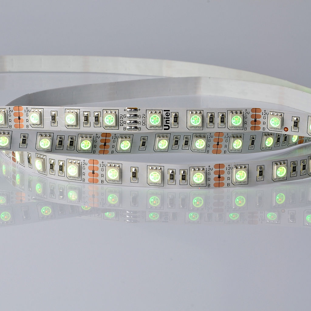 ULS-5050-60LED/m-10mm-IP20-DC24V-14,4W/m-5M-RGB Гибкая светодиодная лента UNIEL на самоклеящейся основе. Упаковка - катушка 5 м. в герметичной упаковке. IP20. Угол излучения 120 . Мультиколор.