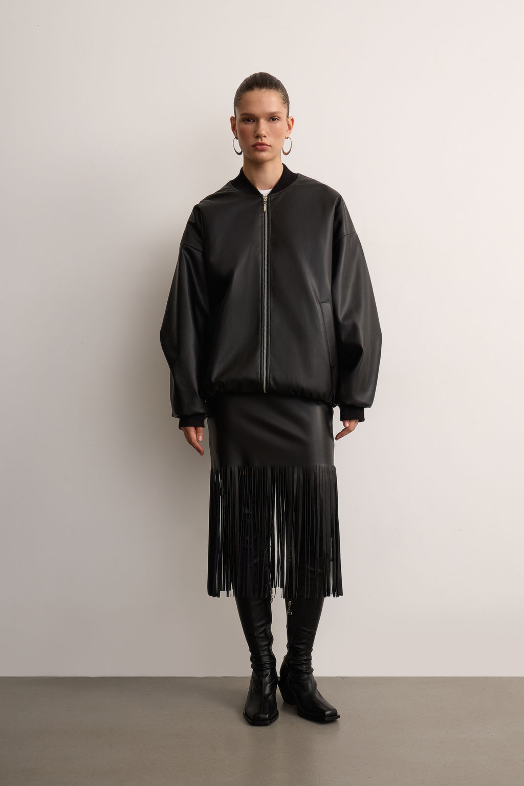 Юбка из экокожи с бахромой