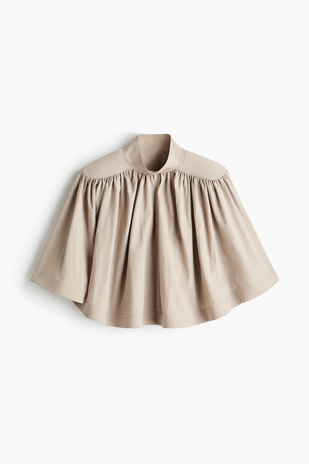 Blusa capa con hombreras