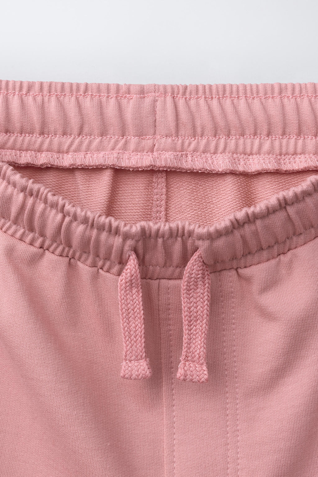 CONJUNTO CAMISETA Y BERMUDA TEXTO / Rosa lavado