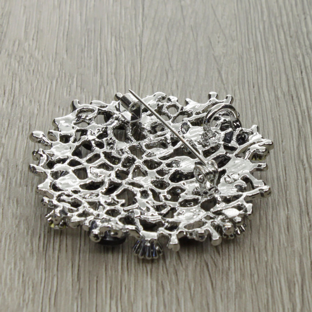 Брошь-подвеска "Калейдоскоп" со вставками из гелиотиса и ювелирного сплава