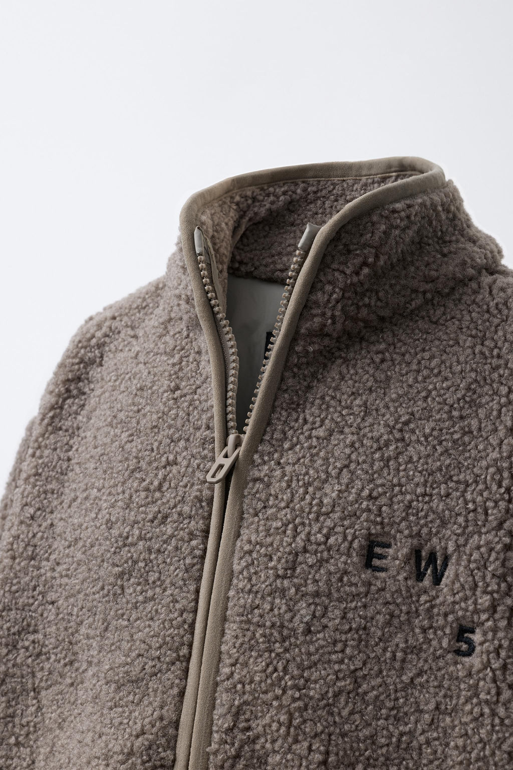 FAUX SHEARLING JACKET WITH EMBROIDERED TEXT