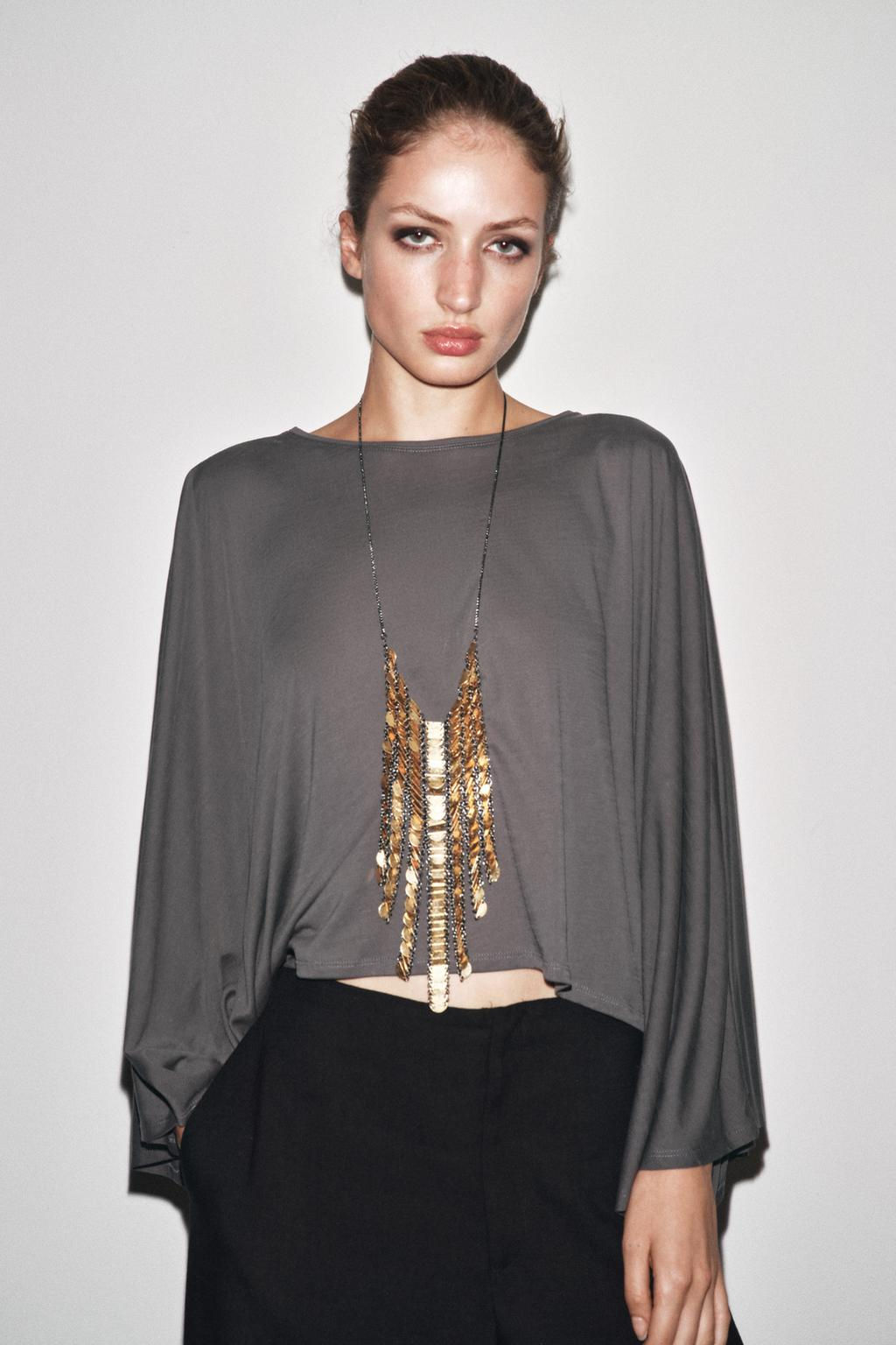 ASYMMETRIC FLOWING CAPE