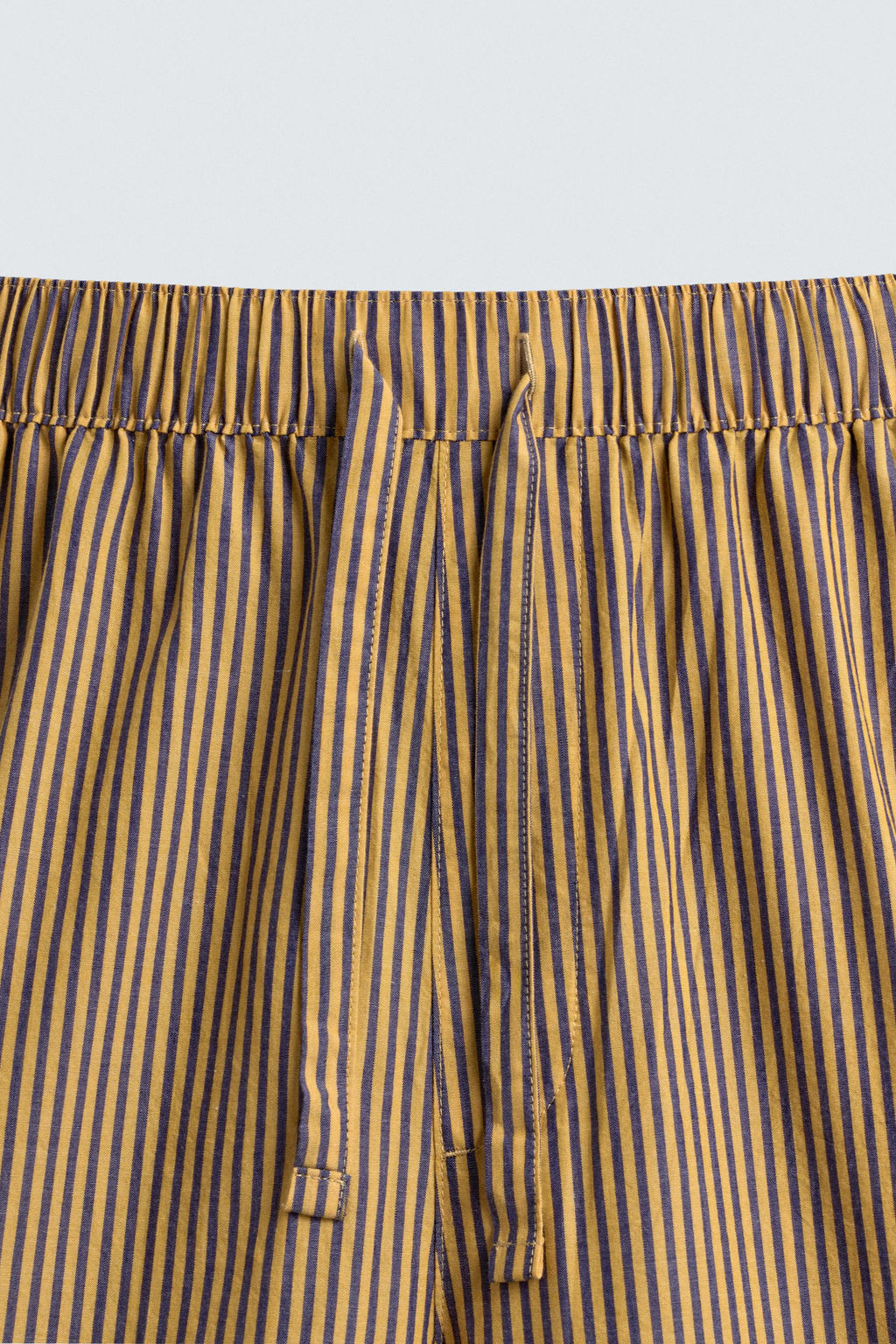STRIPED OVERSIZE FIT TROUSERS