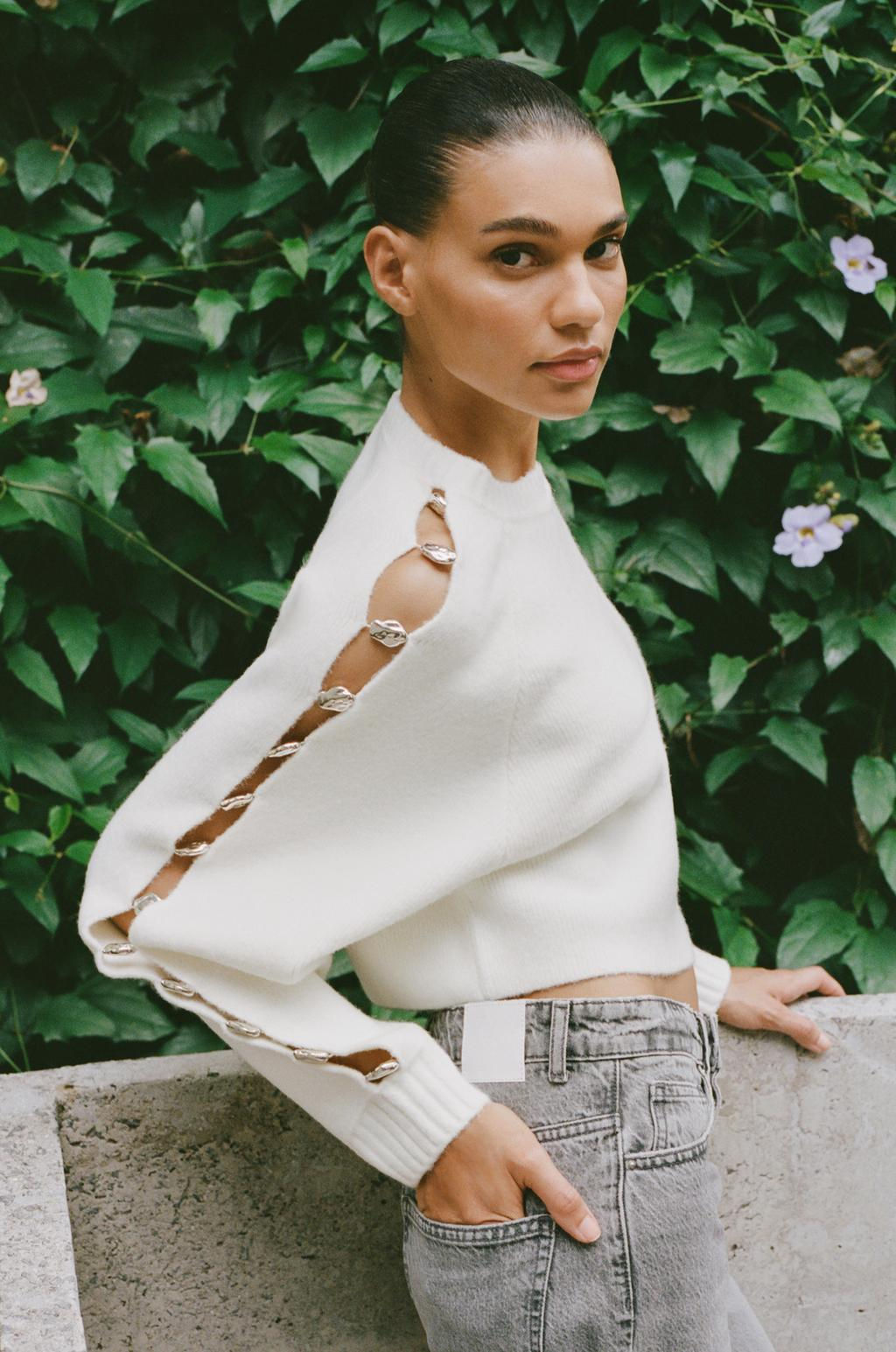 KNITTED SWEATER WITH BALL DETAIL