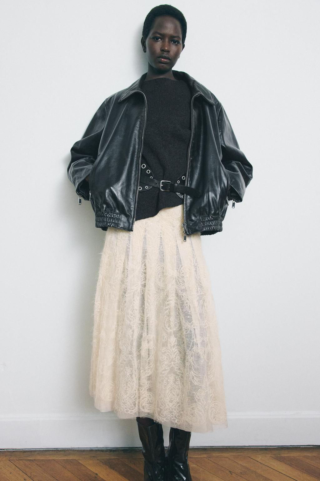 WOOL SLEEVELESS JUMPER WITH SIDE PLEATS
