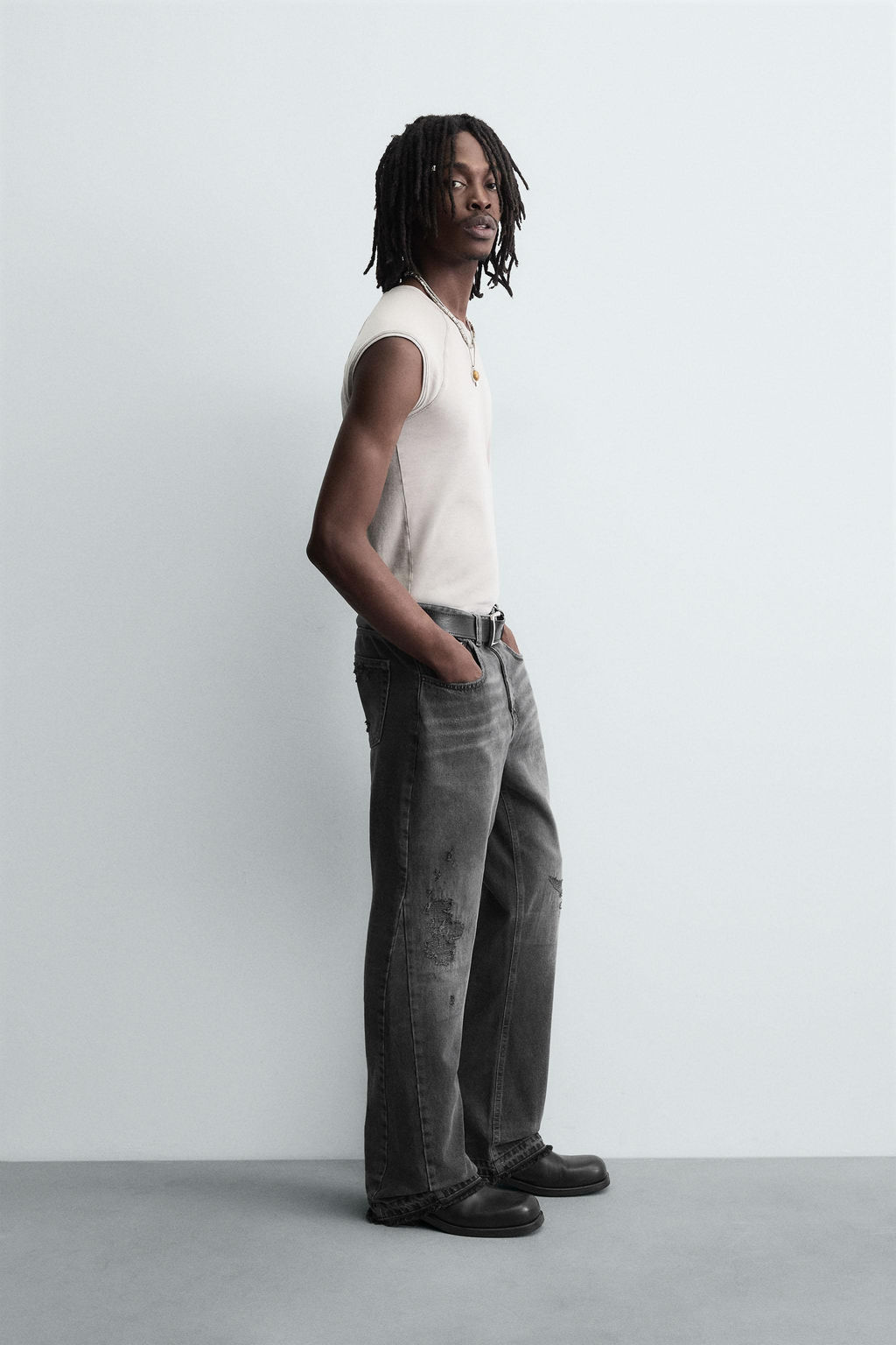 RIPPED BELL BOTTOM FIT JEANS