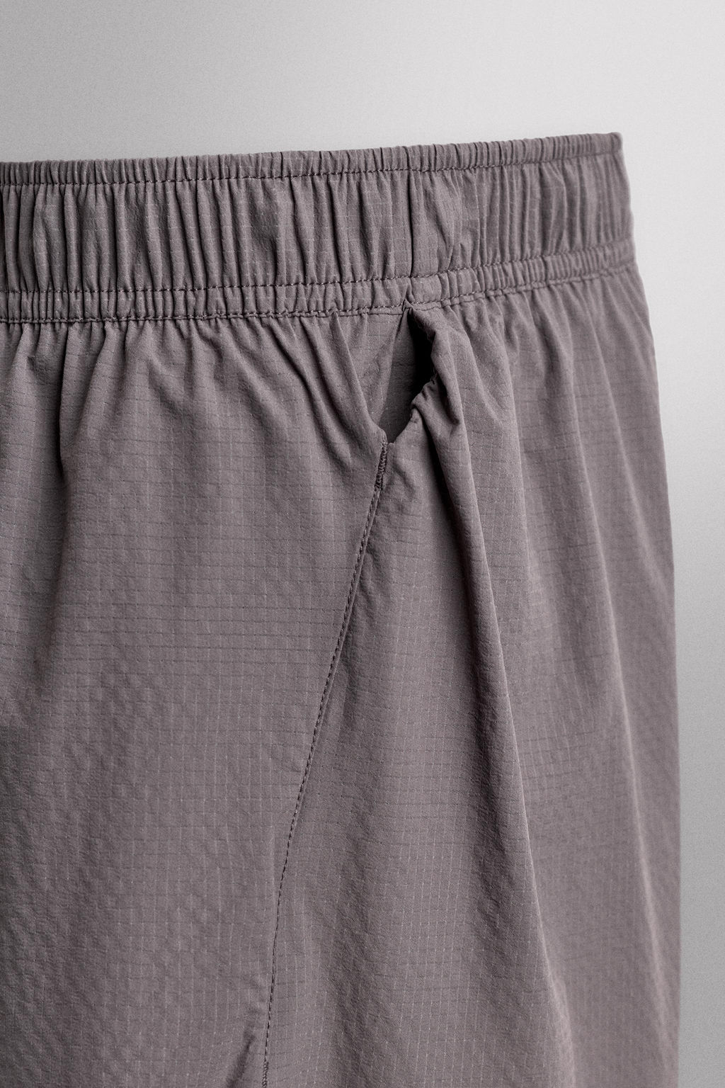 PANTALONES CORTOS LIGEROS RUNNING 3" / Morado