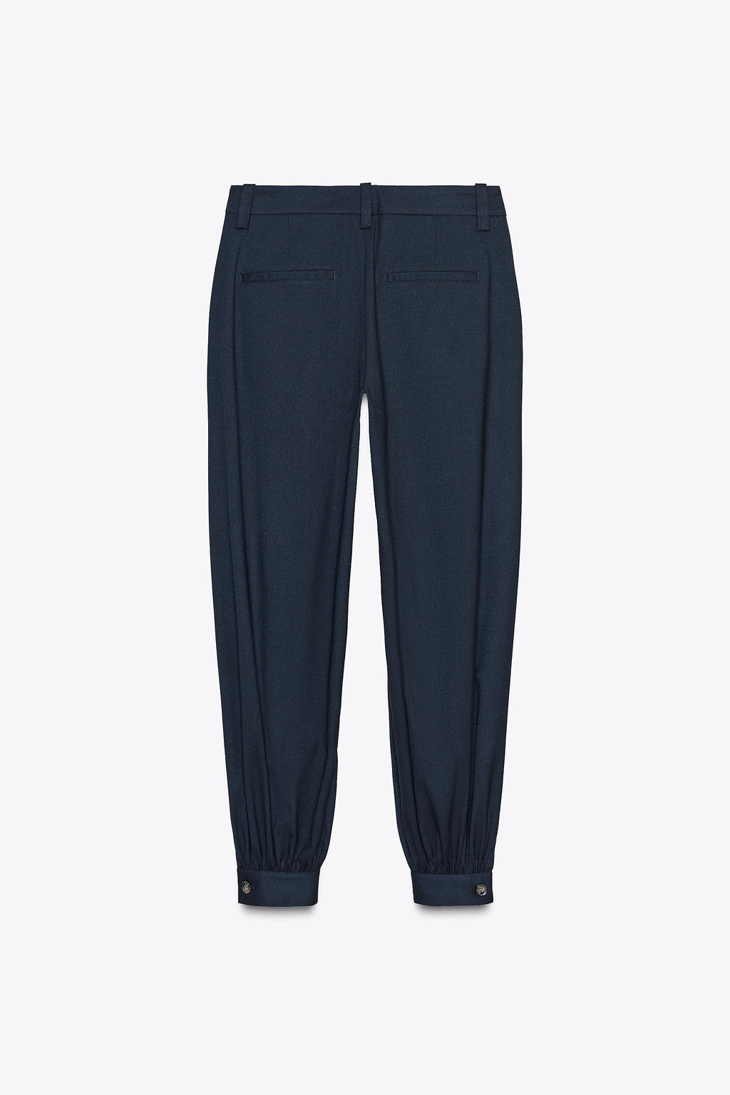 PLEATED TROUSERS WITH BUTTONED HEM
