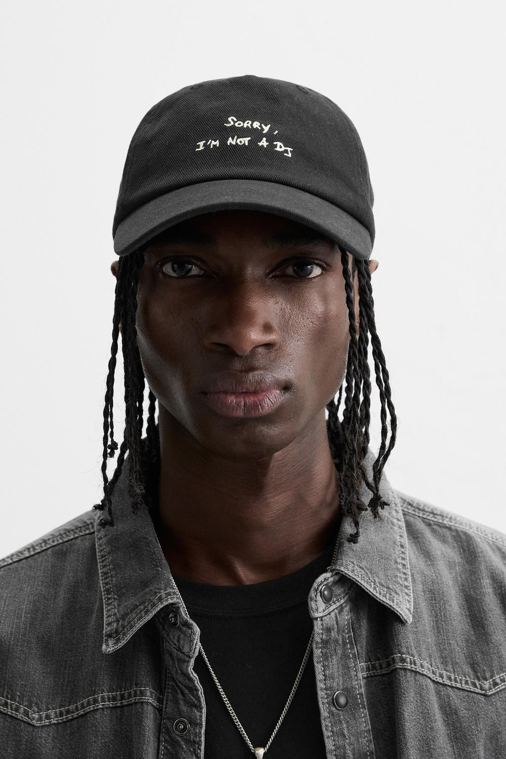 CAP WITH EMBROIDERED SLOGAN