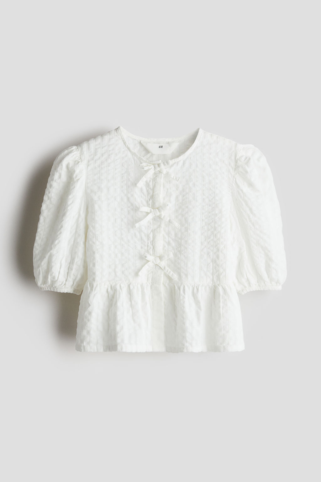 Blusa en sirsaca de algod?n con peplum