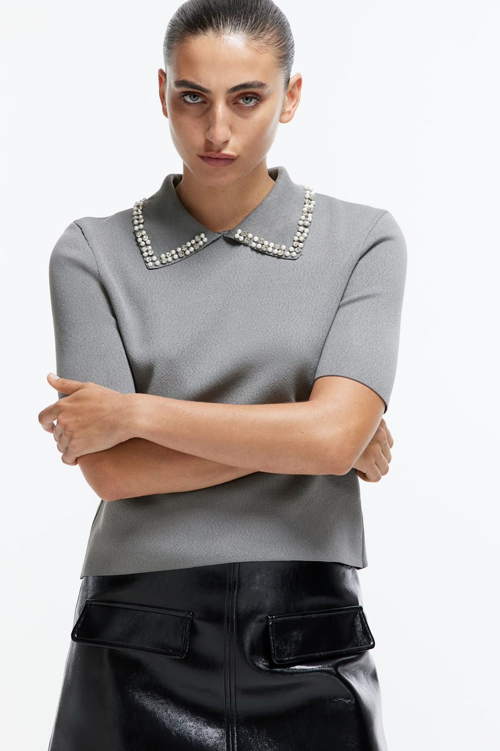Top de punto con cuello decorativo