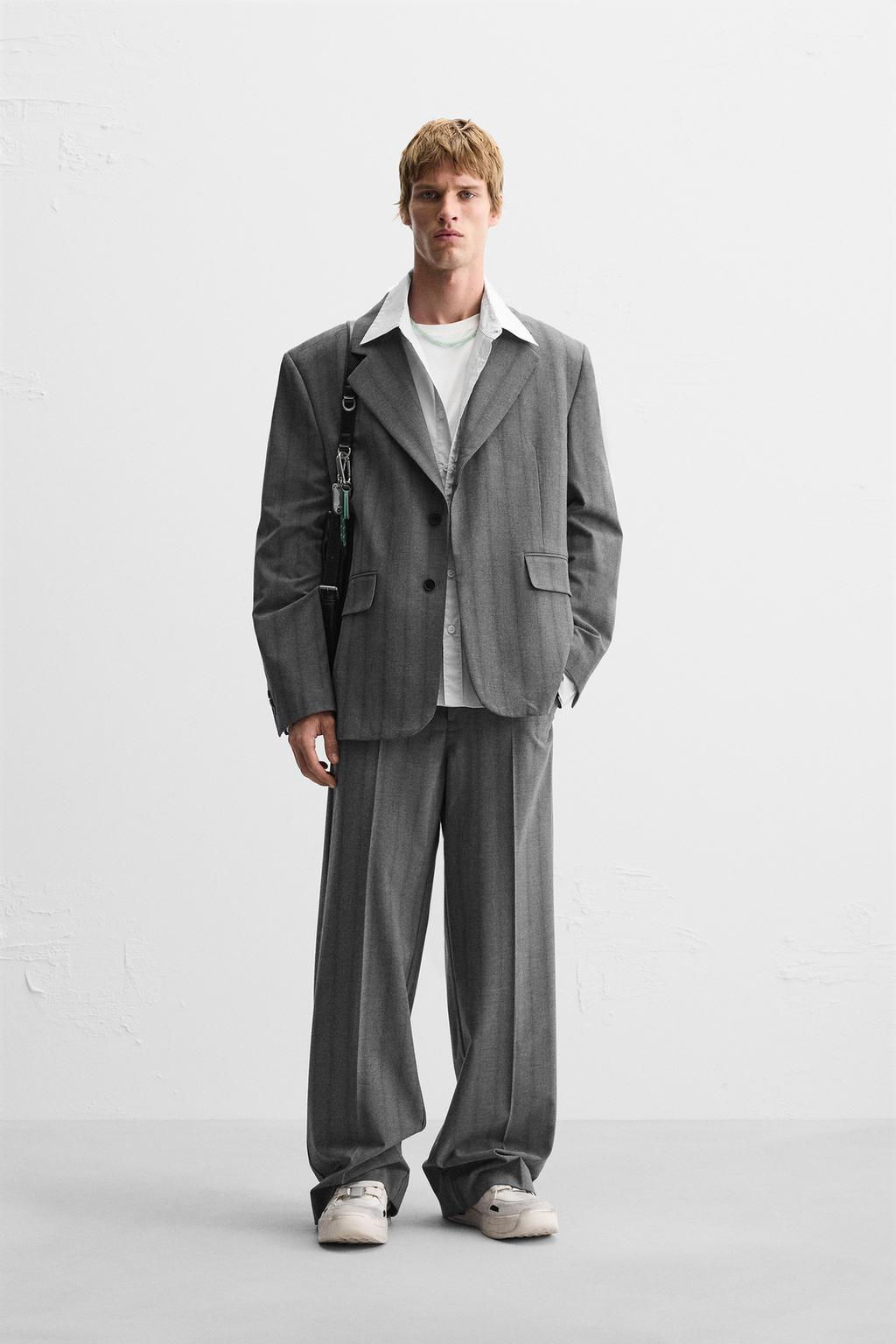 WIDE-FIT PLEATED TROUSERS