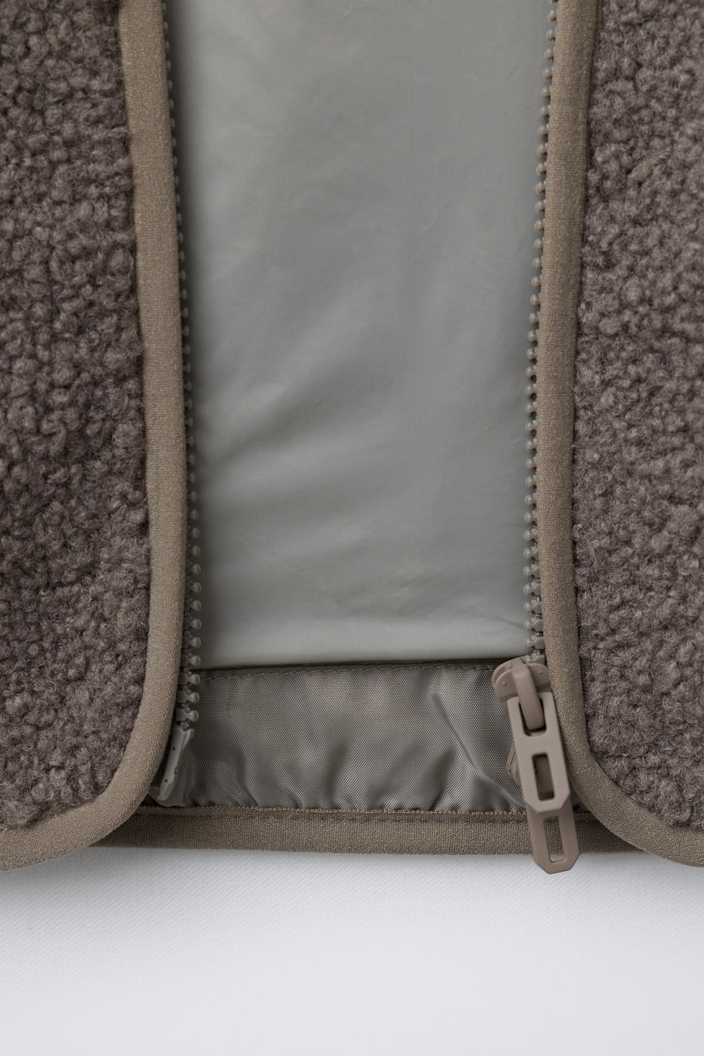 FAUX SHEARLING JACKET WITH EMBROIDERED TEXT