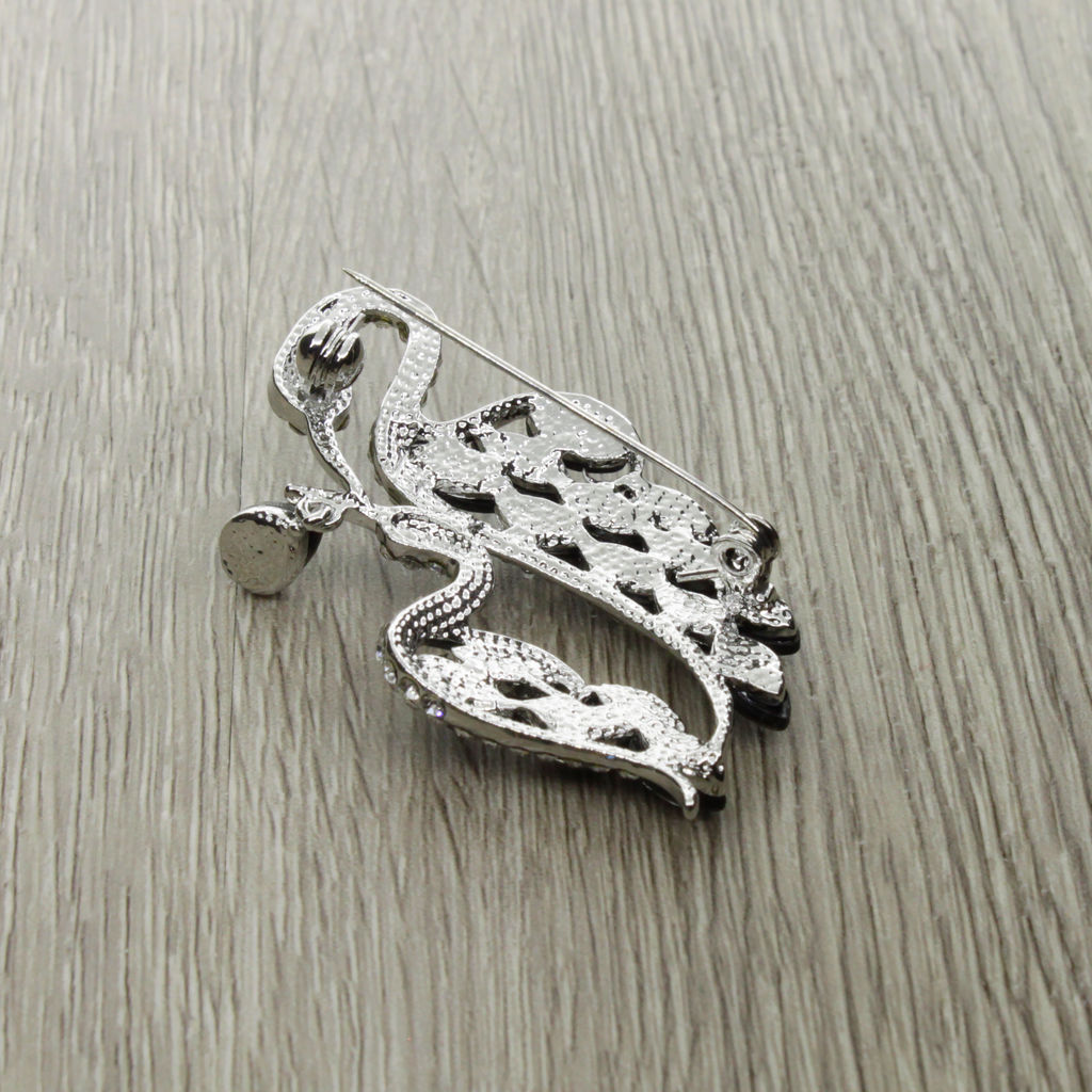 Брошь "Цапли" со вставками из гелиотиса и ювелирного сплава