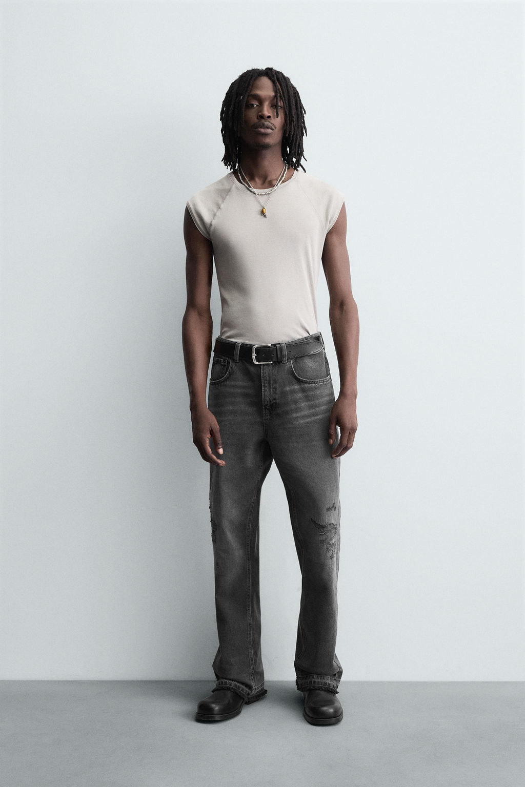 RIPPED BELL BOTTOM FIT JEANS