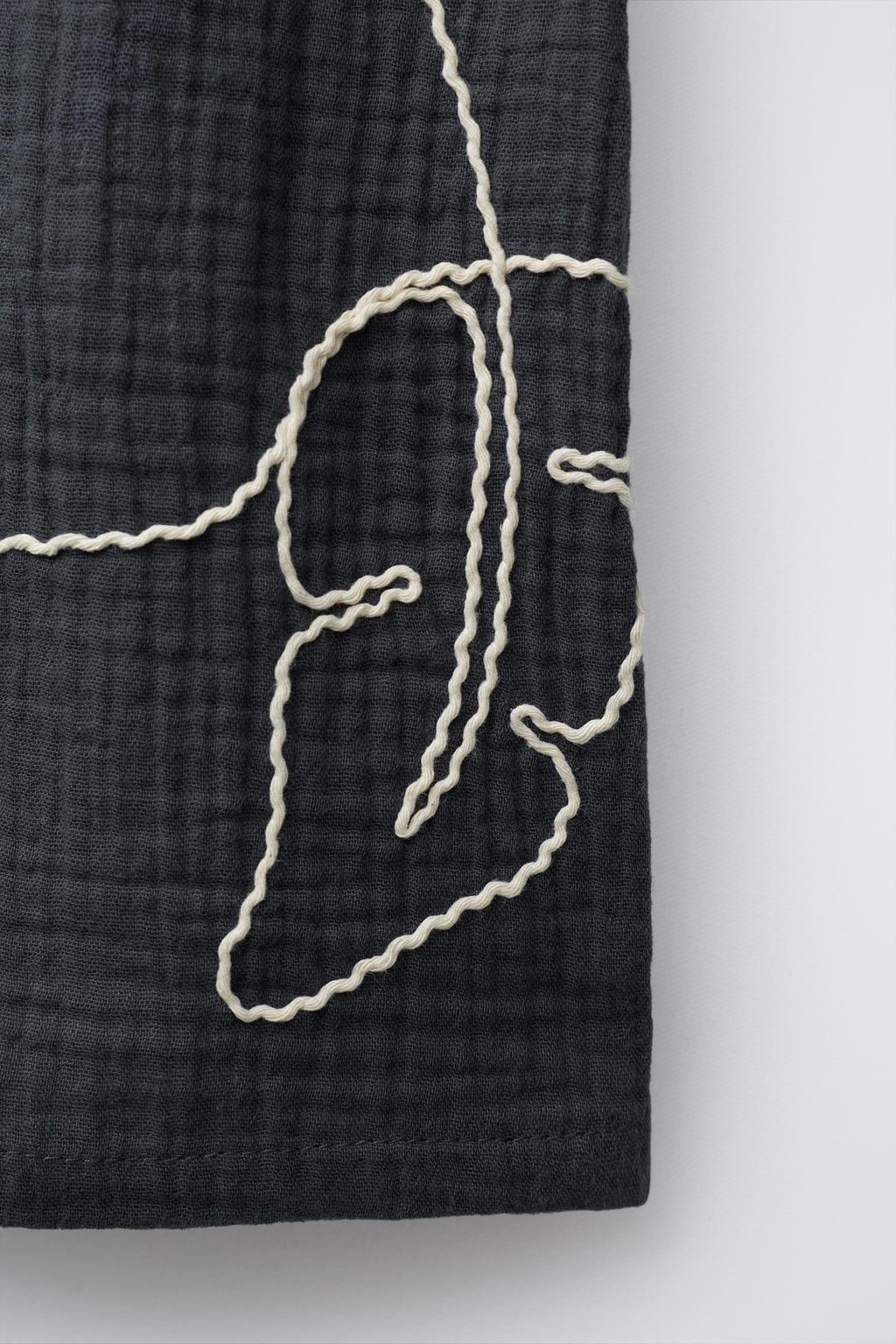 TEXTURED EMBROIDERED BERMUDA SHORTS