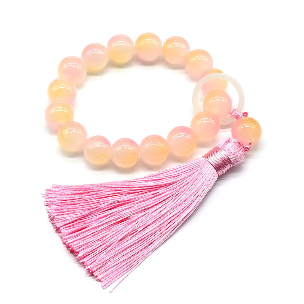 Браслет с кисточкой шарик 12мм цв.персиковый, 16 бусин