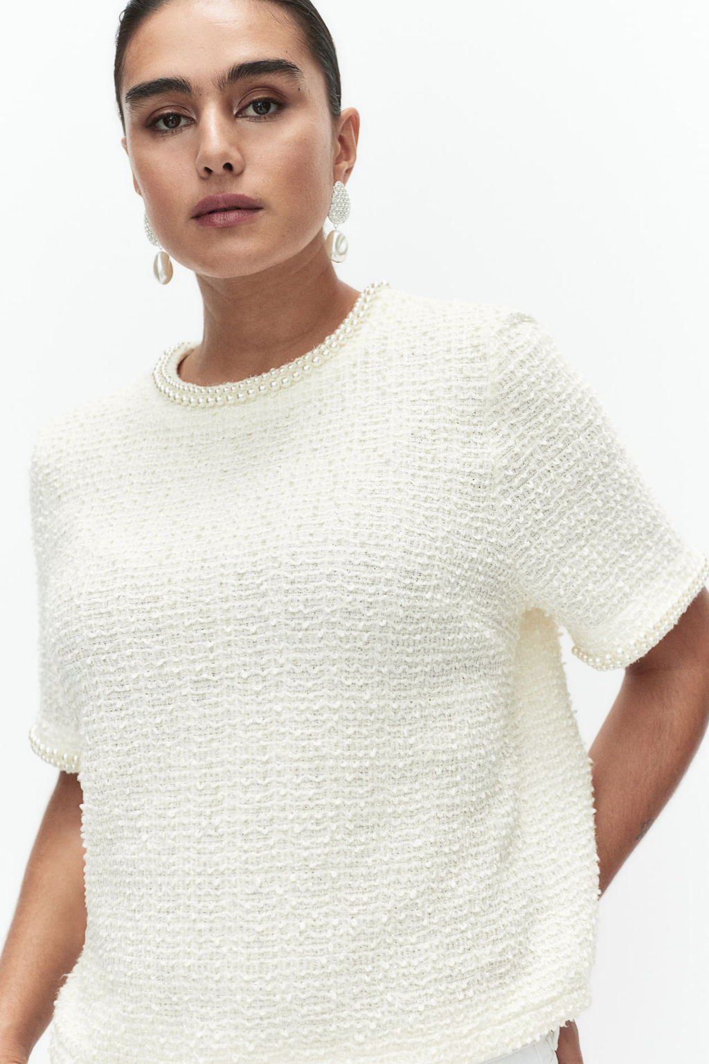 Top en boucle con cuentas decorativas