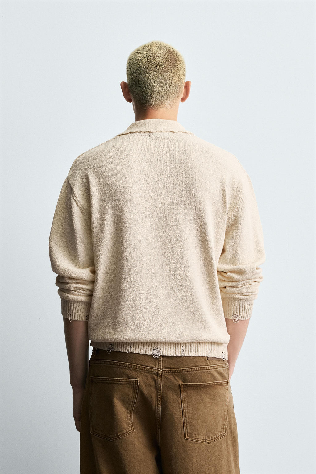 KNITTED RIPPED-EFFECT POLO SHIRT