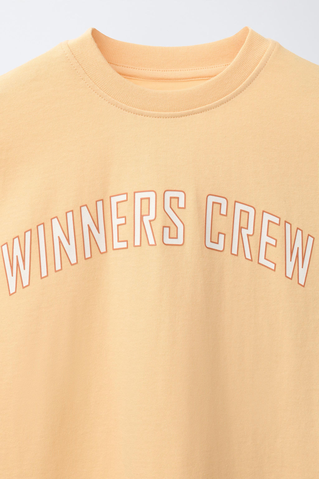 CAMISETA JOGGING TEXTO / Mandarina