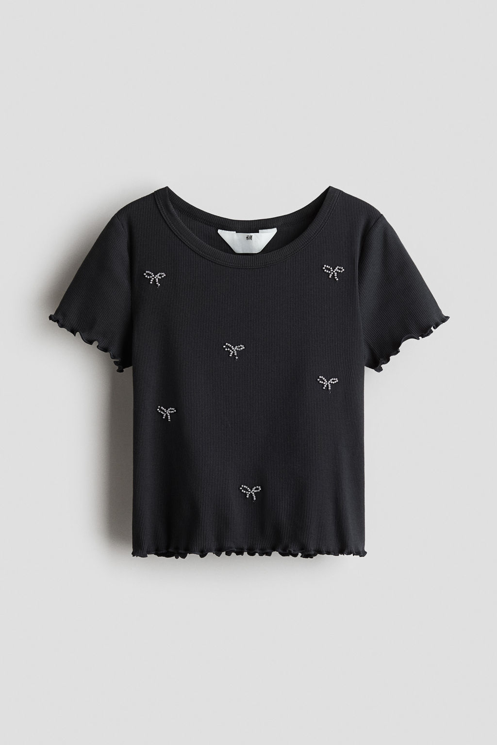 Top de algod?n con detalles decorativos